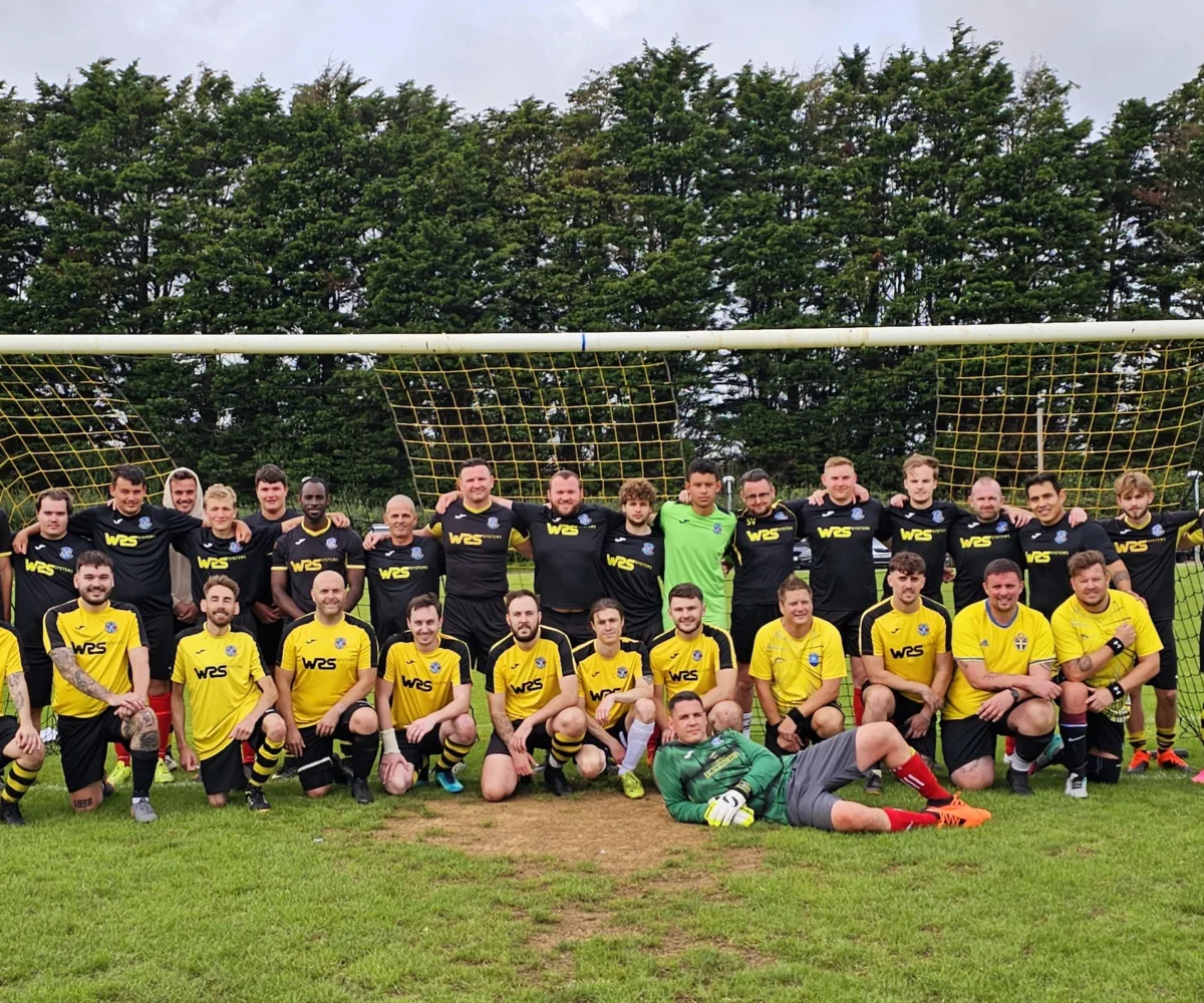 WRS Team group photo with Newchurch football club in field
