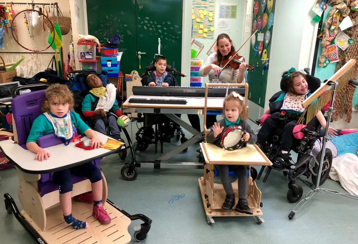 Group of disabled children in a music therapy session