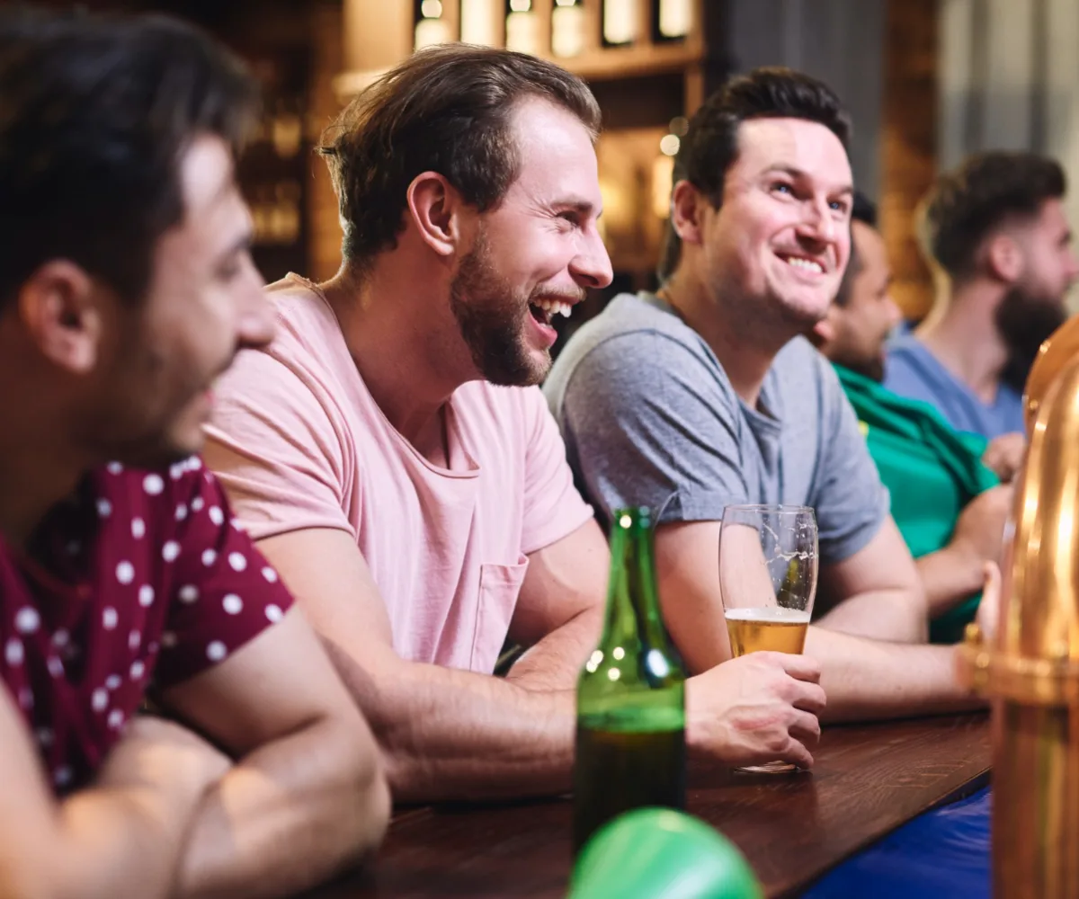 Group of men drinking beers at the pub