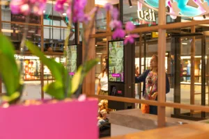 Self-service kiosk at an itsu restaurant being used by customers